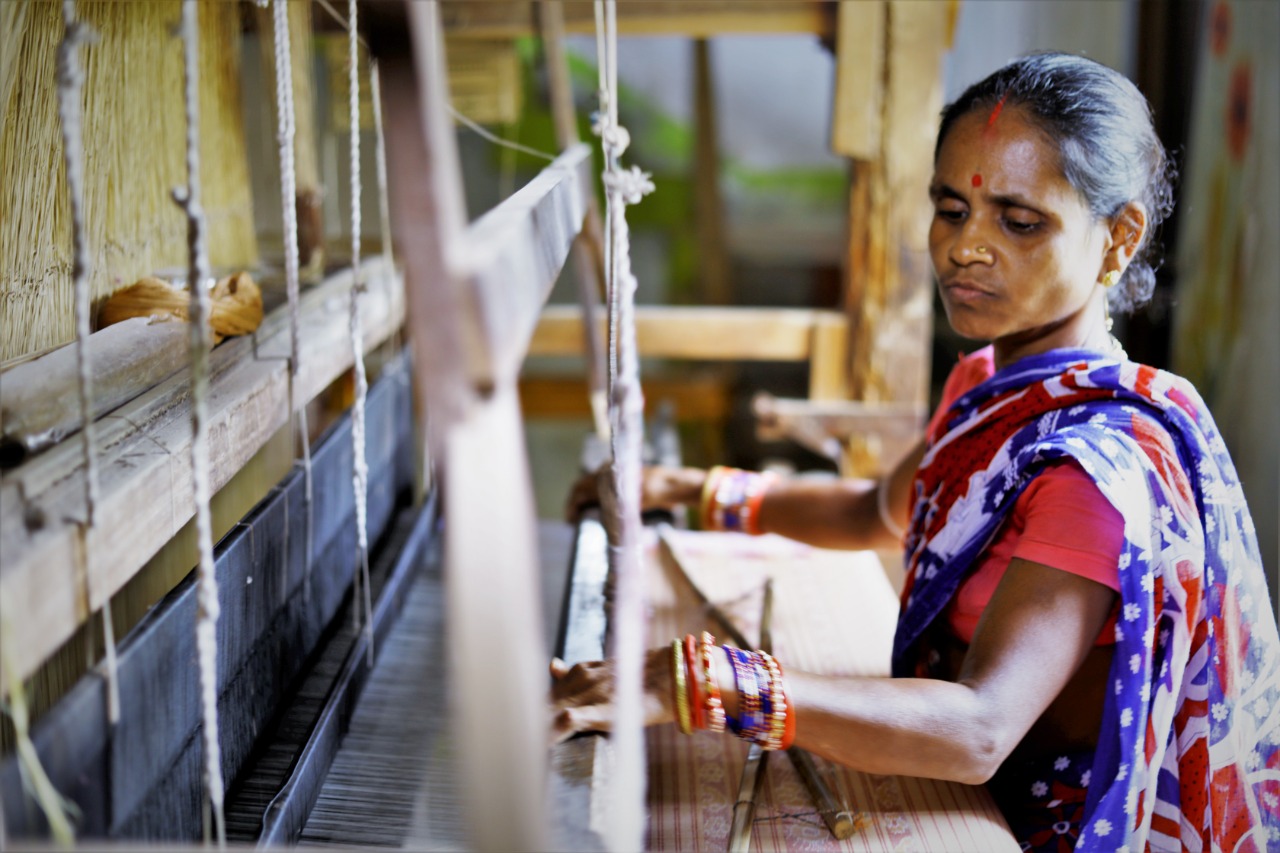 A woman weaver at her handloom